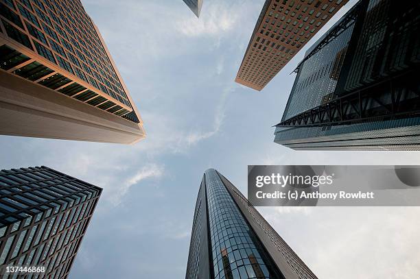 skyscrapers against sky in tokyo - anthony rowlett stock pictures, royalty-free photos & images