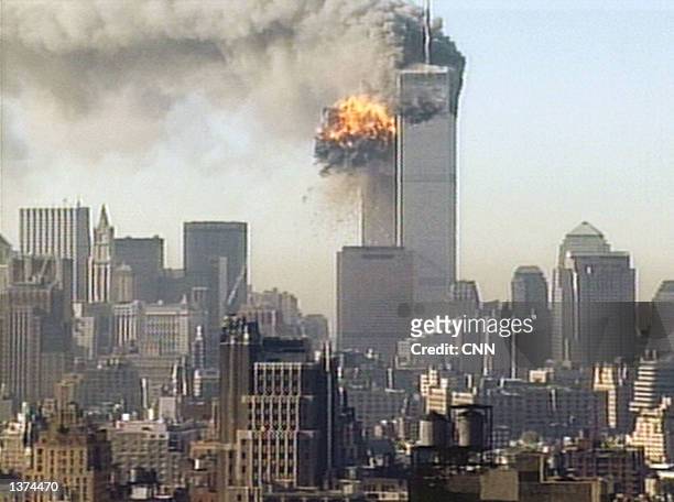 Hijacked United Airlines flight 175 is flown into the south tower of the World Trade Center September 11, 2001 in New York City. The plane is one of...