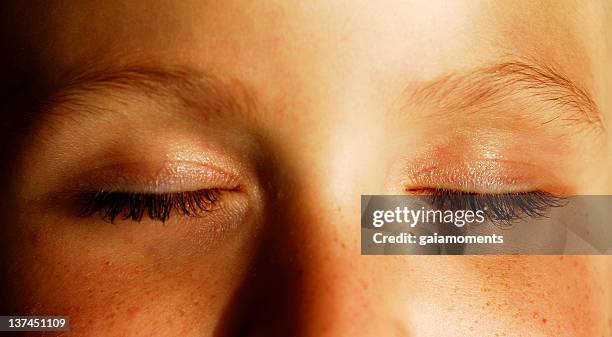 eyes shut - face symmetry stock pictures, royalty-free photos & images