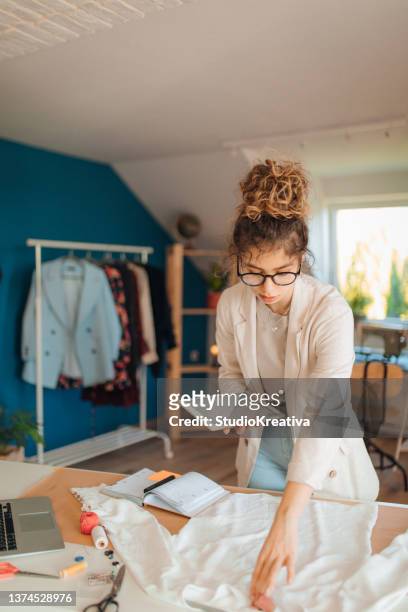 young fashion designer working in her atelier - stylist bildbanksfoton och bilder