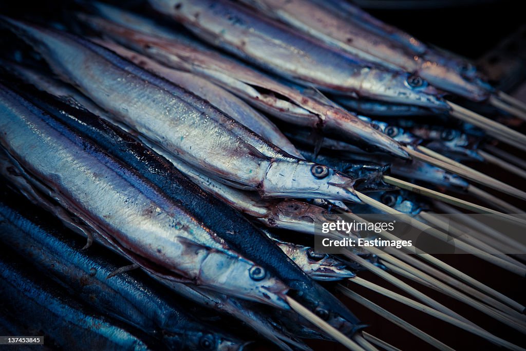 Fish on bamboo sticks to roast,china