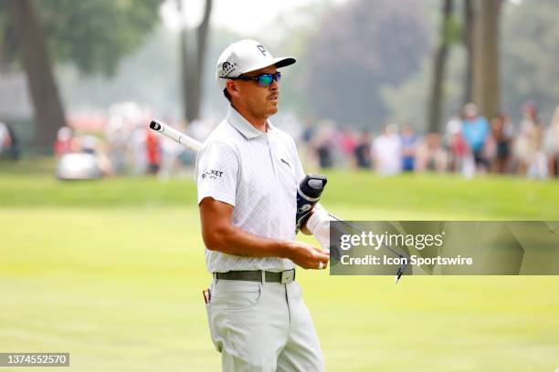 Golfer Rickie Fowler carries his water bottle on the first hole on June 30 during the second round of the Rocket Mortgage Classic at the Detroit Golf...