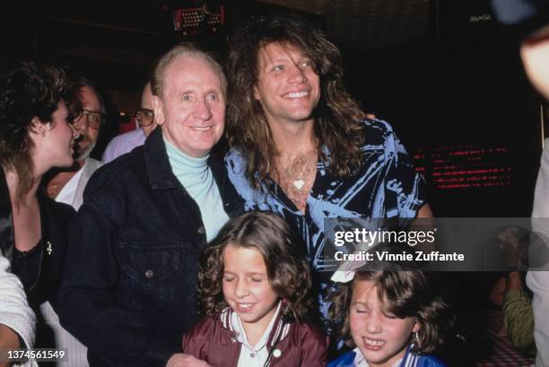 American guitarist, songwriter, and luthier Les Paul and American singer, songwriter and guitarist Jon Bon Jovi among people attend the after party...