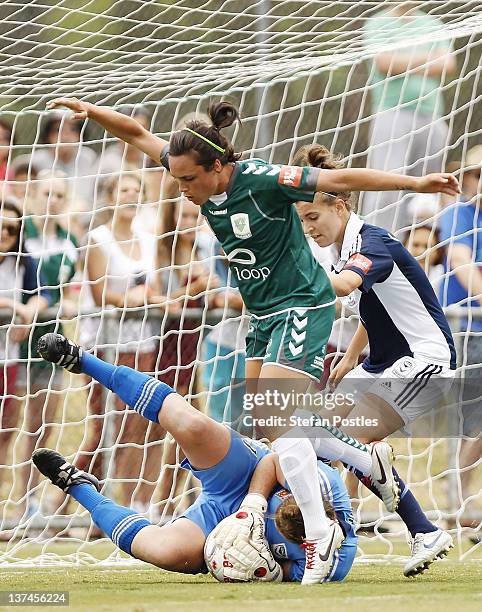 Emma Kete of Canberra United attempts to beat Melbourne Victory goal keeper Brianna Davey to the ball during the W-League Semi Final match between...