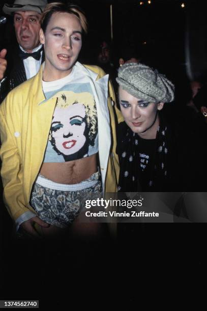 British-Jamaican singer Marilyn, wearing a yellow jacket over a t-shirt bearing Andy Warhol's screen-printed image of Marilyn Monroe, and British...