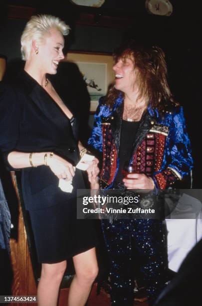 Danish actress Brigitte Nielsen and American singer, songwriter and guitarist Jon Bon Jovi attend the after-party that followed the 15th Annual...