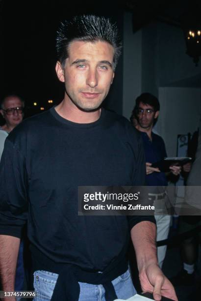 American actor William Baldwin, wearing a black t-shirt and jeans, attends the Beverly Hills premiere of 'Stealing Beauty,' held at the AMC Fine Arts...