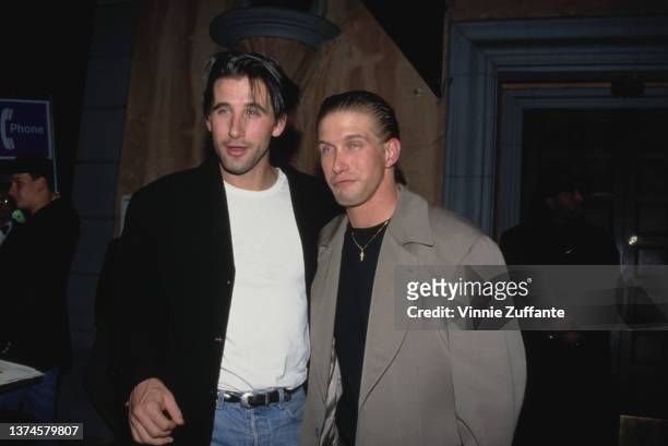 American actor William Baldwin, wearing a black jacket over a white t-shirt and jeans, with his brother, American actor Stephen Baldwin, circa 1995.