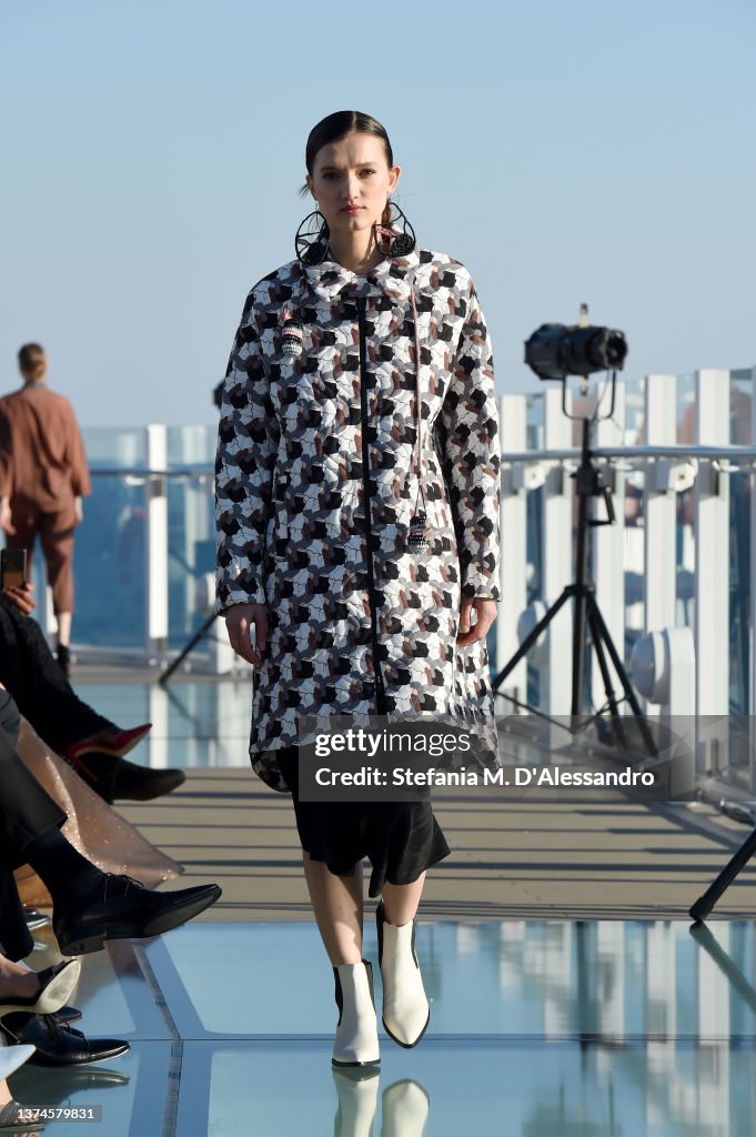 J Spring A model walks the runway at the J Spring fashion show on the Costa ...