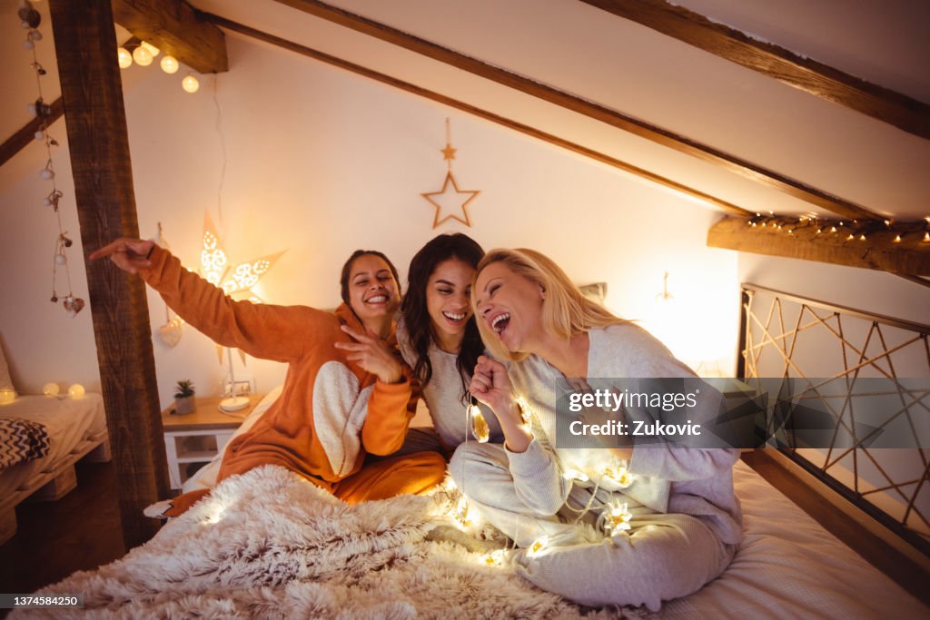 Female friends having good time on a sleepover