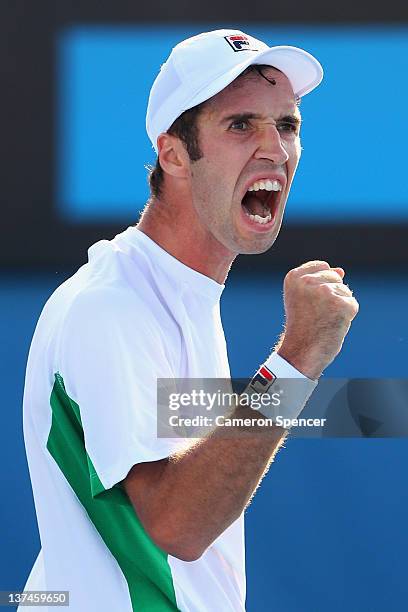 Mikhail Kukushkin of Kazakhstan celebrates winning the second set in his third round match against Gael Monfils of France during day six of the 2012...