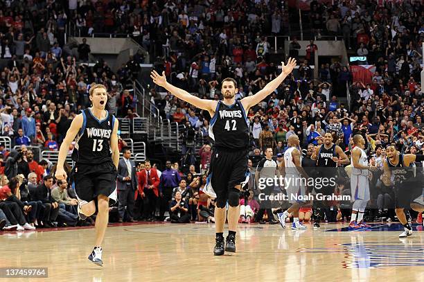 Kevin Love and Luke Ridnour of the Minnesota Timberwolves celebrate the win against the Los Angeles Clippers at Staples Center on January 20, 2012 in...