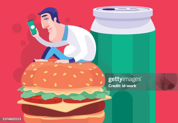 illustrazioni stock, clip art, cartoni animati e icone di tendenza di uomo stanco seduto su un grande hamburger e guardando lo smartphone - lentezza