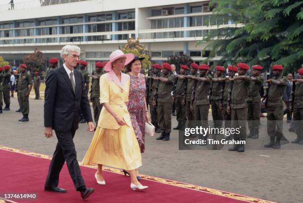 British Royal Diana, Princess of Wales , wearing a yellow-and-pink Catherine Walker suit with a pink Philip Somerville hat, during a visit to a...