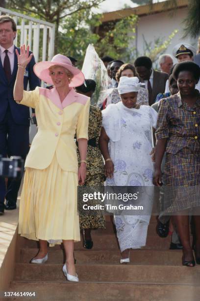 British Royal Diana, Princess of Wales , wearing a yellow-and-pink Catherine Walker suit with a pink Philip Somerville hat, during a visit to a...