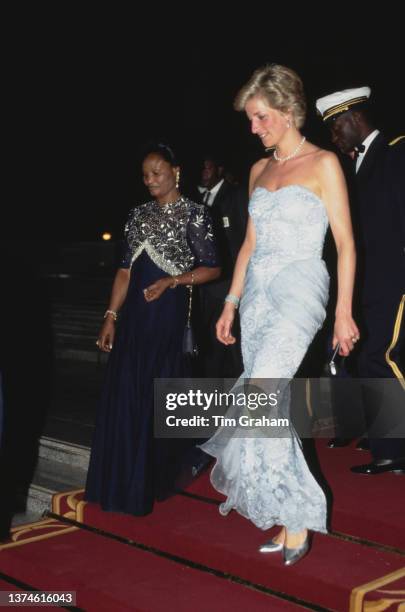 Diana, Princess of Wales , wearing a pale blue Catherine Walker strapless evening dress, with dignitaries as she attends a State Dinner at YaoundÃ©...