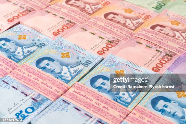 thai baht banknotes. savings and investing concept - thai coin stock pictures, royalty-free photos & images