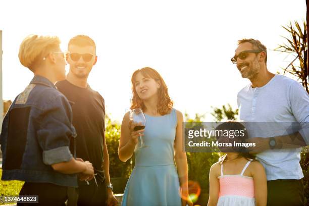 people in backyard during asado party - sunny backyard stock pictures, royalty-free photos & images