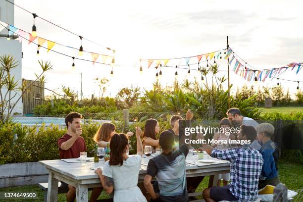 father with daughter during birthday party in yard - standing table outside stock pictures, royalty-free photos & images