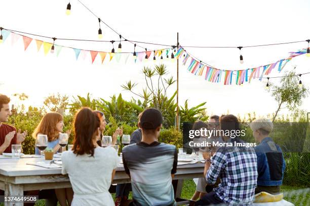 man with daughter during birthday party - family applauding stock pictures, royalty-free photos & images