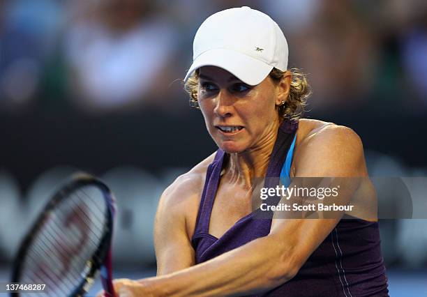 Greta Arn of Hungary plays a backhand in her third round match against Serena Williams of the United States of America during day six of the 2012...