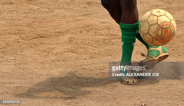 Youth plays football in a Malabo suburb on January 21, 2012 hours before the opening game of the 2012 African Cup of Nations between Equatorial...