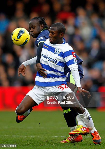 Shaun Wright-Phillips of QPR is challenged by Victor Moses of Wigan during the Barclays Premier League match between Queens Park Rangers and Wigan...