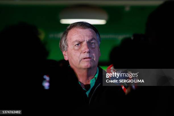 Brazilian former President, Jair Bolsonaro, speaks to the press at the Juscelino Kubitschek International Airport in Brasilia on June 30, 2023....