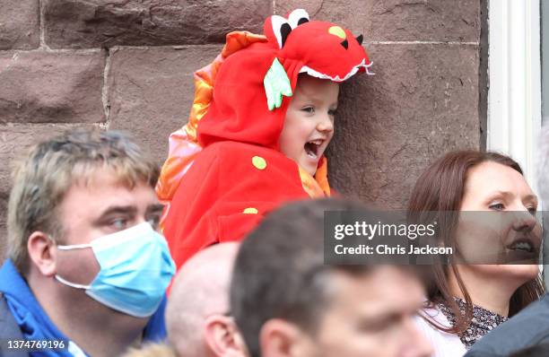 Young well-wisher waits for the arrival of Prince William, Duke of Cambridge and Catherine, Duchess of Cambridge for a visit to Abergavenny Market to...