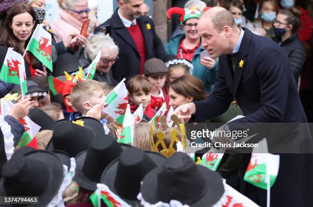 Prince William, Duke of Cambridge speaks with well-wishers during a visit to Abergavenny Market with Catherine, Duchess of Cambridge, to see how...