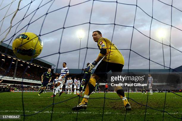 Goalkeeper Paddy Kenny of QPR watches as the ball hits the back of his net from a Hugo Rodallega of Wigan free kick during the Barclays Premier...