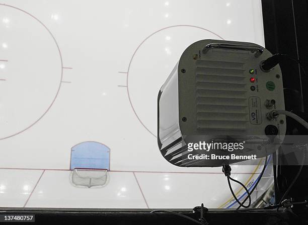 New goal line replay camera sits high off the ice prior to the game between the New York Islanders and the Nashville Predators at the Nassau Veterans...