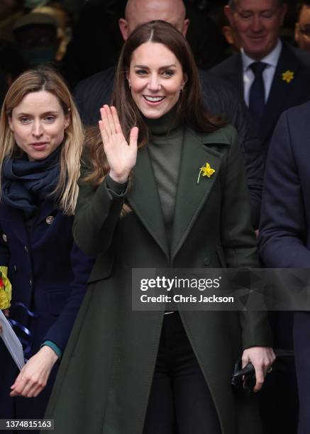 Catherine, Duchess of Cambridge waves to well-wishers during a visit to Abergavenny Market with Prince William, Duke of Cambridge, to see how...