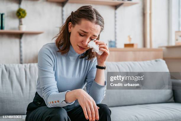 young woman crying - sadness home stock pictures, royalty-free photos & images