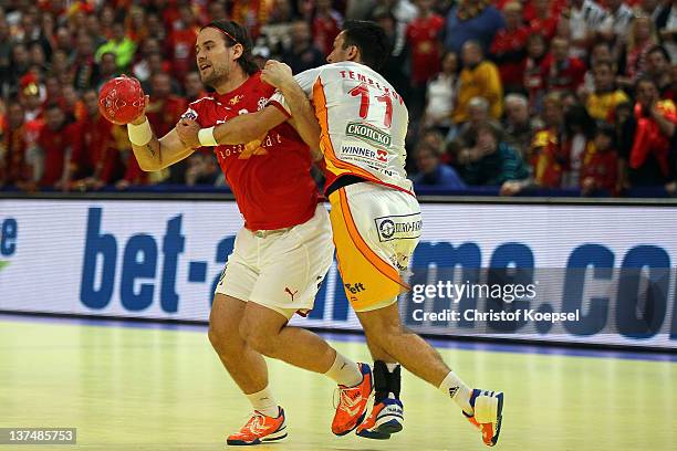 Vladimir Temelkov of Macedonia defends against Thpomas Mogensen of Denmark during the Men's European Handball Championship second round group one...