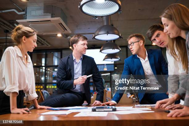 rebranding help your business move into the future. business development team during a meeting and discussion about improve rebranding by focusing on the right target market  in a business office. - corporate gender equality stock pictures, royalty-free photos & images