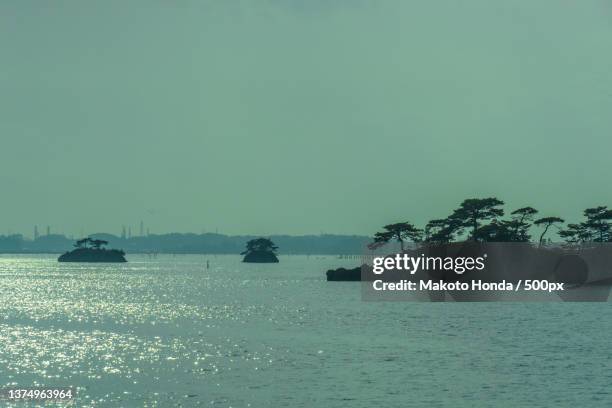 nippon miyama matsushima landscape,scenic view of sea against clear sky - miyagi prefecture stock pictures, royalty-free photos & images