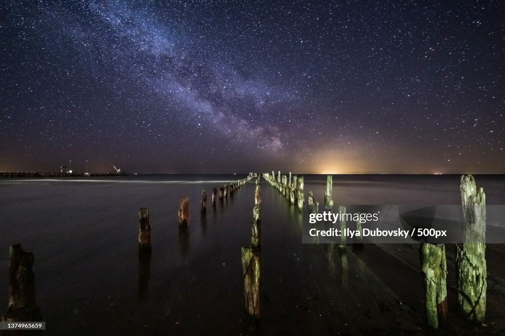 Milky way over broken pier,Scenic view of sea against sky at night,Kolka,Kolka parish,Latvia