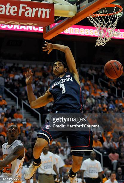 Jeremy Lamb of Connecticut dunks in the first half against Jordan McRea and Tennessee at Thompson-Boling Arena in Knoxville, Tennessee, on Saturday,...