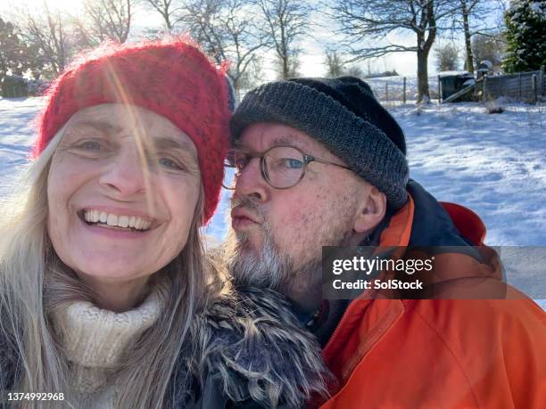 winter kisses - taken on mobile device stock pictures, royalty-free photos & images