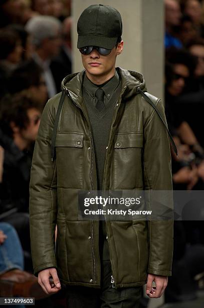 Model walks the runway during the Dior Homme Menswear Autumn/Winter 2013 show as part of Paris Fashion Week on January 21, 2012 in Paris, France.