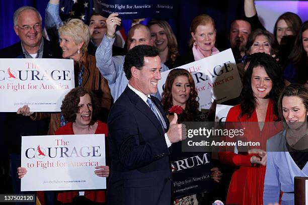 Republican presidential candidate, former U.S. Sen. Rick Santorum gives a thumbs-up while walking on stage at his primary-night event on January 21,...