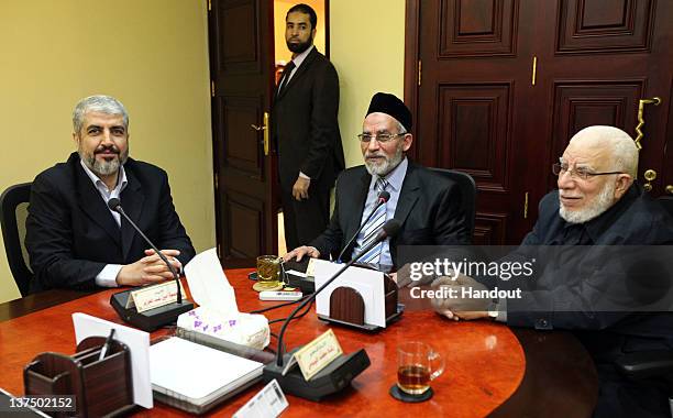 In this handout photo provided by Khaled Meshaal's Office of Media, the leader of Hamas Khaled Meshaal meets with Supreme Leader of the Muslim...