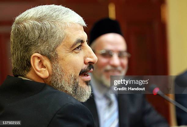 In this handout photo provided by Khaled Meshaal's Office of Media, the leader of Hamas Khaled Meshaal meets with Supreme Leader of the Muslim...