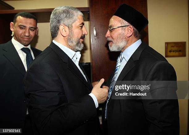 In this handout photo provided by Khaled Meshaal's Office of Media, the leader of Hamas Khaled Meshaal meets with Supreme Leader of the Muslim...