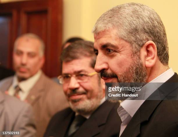 In this handout photo provided by Khaled Meshaal's Office of Media, the leader of Hamas Khaled Meshaal visits the headquarters of the Freedom and...