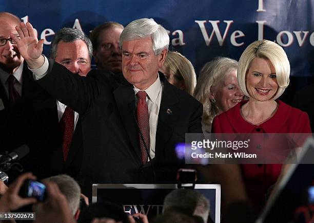 Republican presidential candidate, former Speaker of the House Newt Gingrich and his wife Callista Gingrich celebrate as they arrive for a primary...