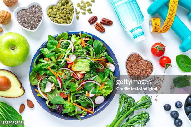 healthy fresh vegetables salad plate on white background - water bottle on white stock pictures, royalty-free photos & images