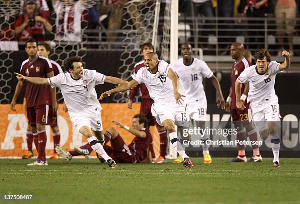 Ricardo Clark of USA celebrates with Michael Parkhurt, C.J. Sapong and Brad Evans after Clark scored against Venezuela during the final moments of...