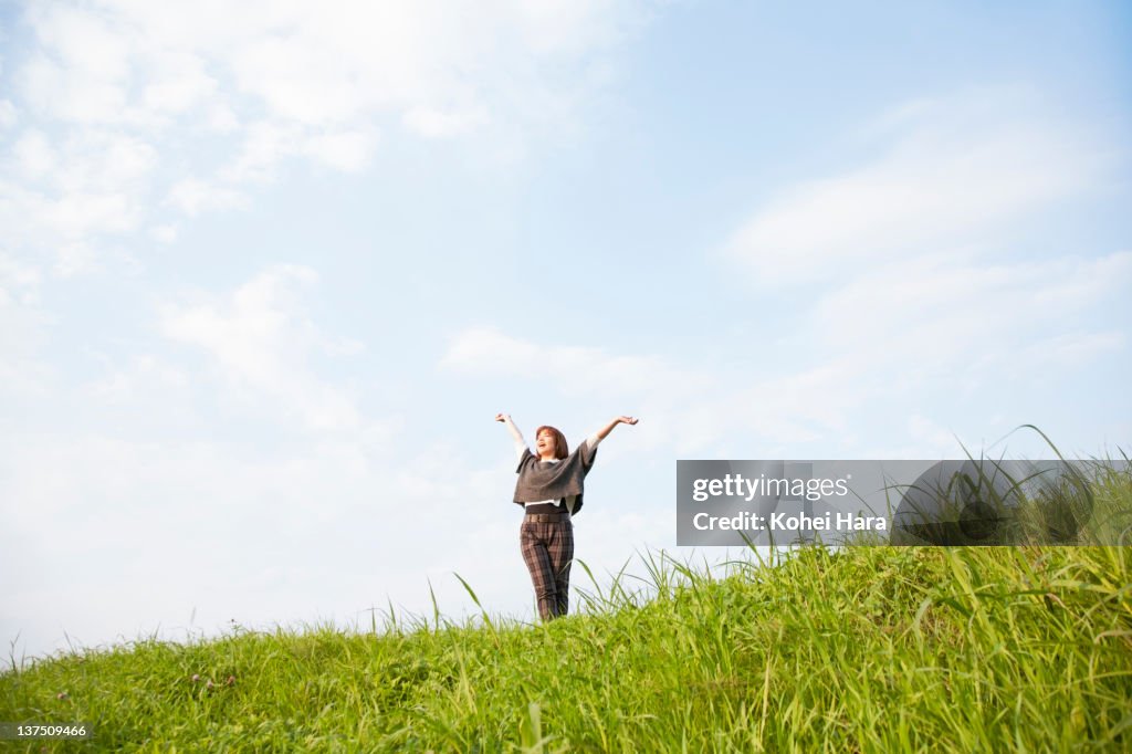 Woman on a small hill